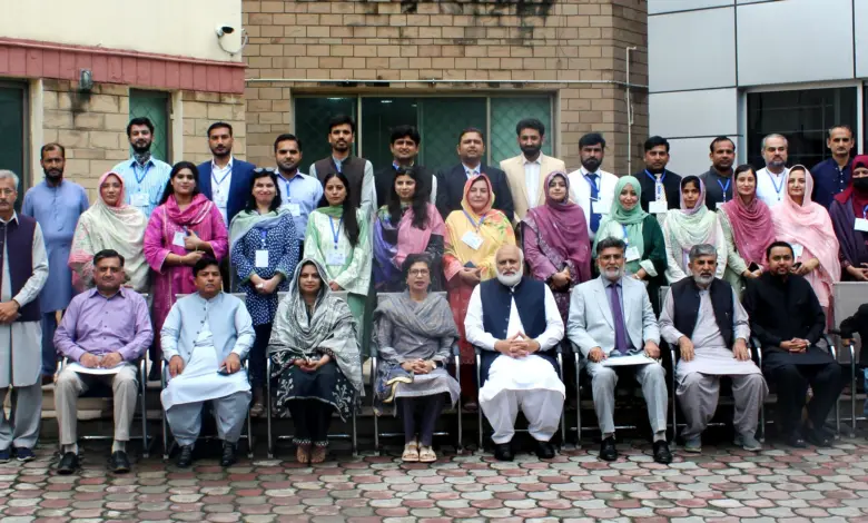 HEC Chairman Prof Dr Niaz Ahmad Akhtar awarding certificates to IPFP Fellows at NAHE closing ceremony