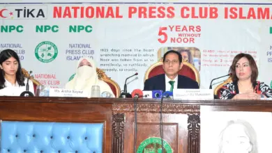 Participants at a memorial ceremony for Noor Mukadam in Islamabad