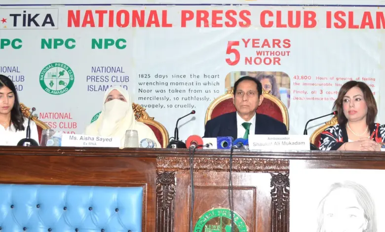 Participants at a memorial ceremony for Noor Mukadam in Islamabad