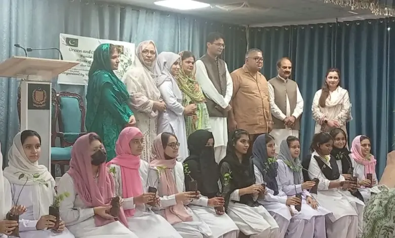 Guests and students at a tree plantation campaign at Women Welfare and Development Centre in Islamabad