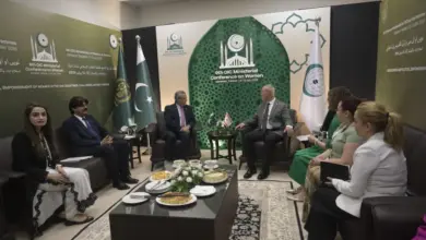 TRNC Minister Oğuzhan Hasipoğlu addressing the OIC ministerial conference in Islamabad