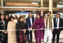Young artists display paintings on the Kashmir issue at Conflict Through Art competition in Islamabad