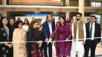Young artists display paintings on the Kashmir issue at Conflict Through Art competition in Islamabad