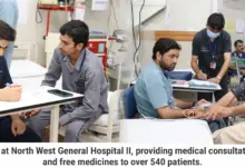 Patients receiving healthcare services at a free medical camp at Northwest General Hospital II