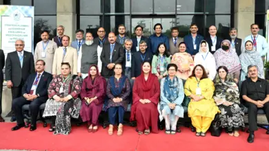 Wajiha Qamar with vice chancellors and senior officials at HEC leadership workshop