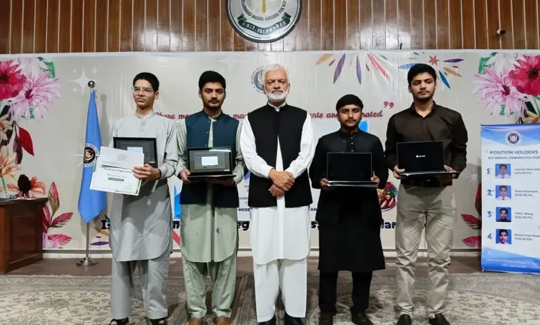 Prof Shahid Mahmood Abbasi presenting awards to SSC high achievers at IMCB I-8/3 Islamabad