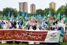 Women participating in Jamaat-e-Islami protest outside National Press Club Islamabad against petroleum levy