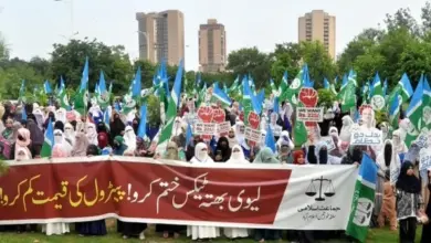 Women participating in Jamaat-e-Islami protest outside National Press Club Islamabad against petroleum levy