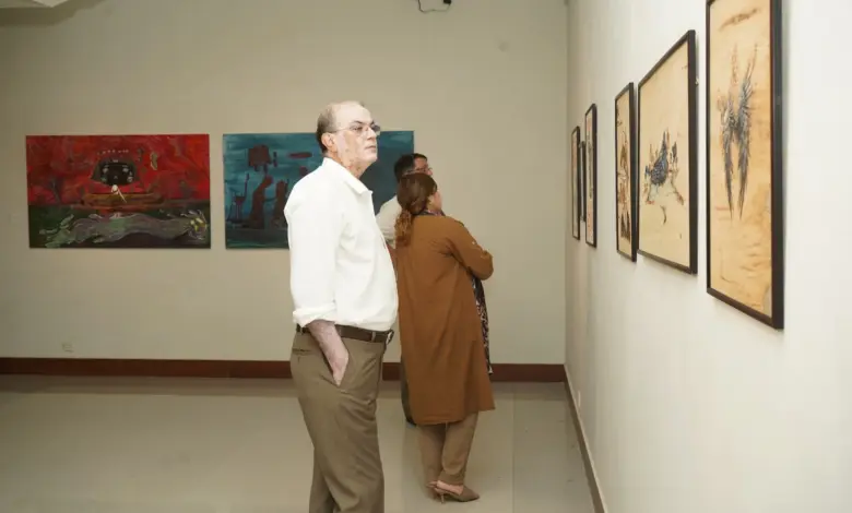 Visitors viewing contemporary artworks at PNCA Young Graduates Exhibition in Islamabad