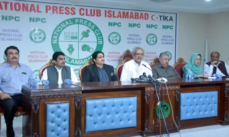 Shahid Khaqan Abbasi addressing a press conference at the National Press Club Islamabad