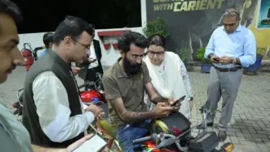 Federal Minister Shaza Fatima Khawaja speaking to citizens at a petrol pump