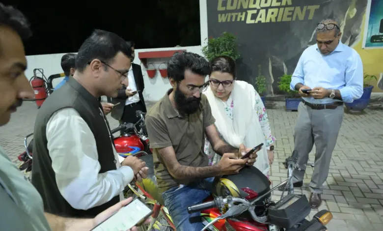 Federal Minister Shaza Fatima Khawaja speaking to citizens at a petrol pump