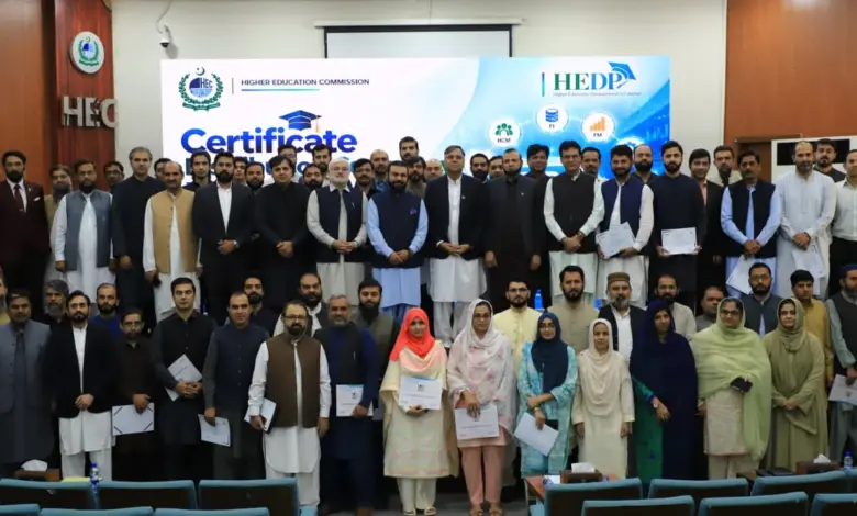 Executive Director HEC Dr Zia Ul Haq presents certificate to an official after SAP S/4HANA training
