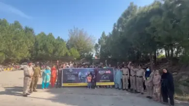 Motorway Police officers and citizens participating in a Kashmir Black Day solidarity walk