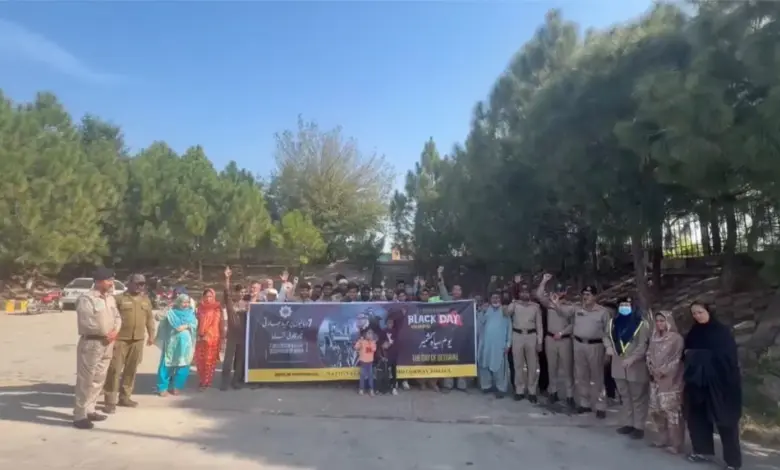 Motorway Police officers and citizens participating in a Kashmir Black Day solidarity walk
