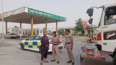 Motorway Police personnel providing assistance and road safety guidance to travellers