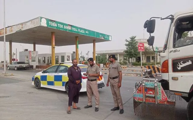 Motorway Police personnel providing assistance and road safety guidance to travellers