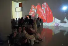 Visitors view NusratJi’s solo exhibition at the National Art Gallery Islamabad