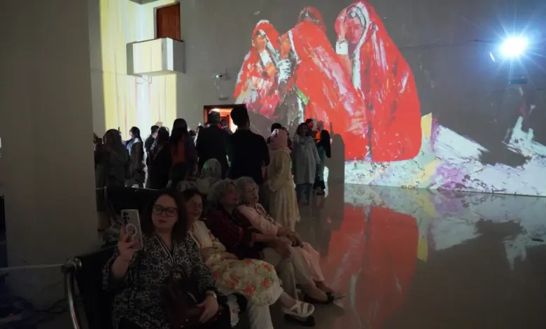Visitors view NusratJi’s solo exhibition at the National Art Gallery Islamabad