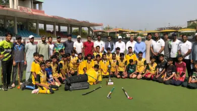 Chamkani players receiving the Peshawar Inter-School Hockey Tournament trophy